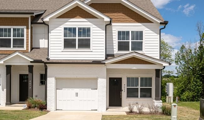 a house with garages and a driveway