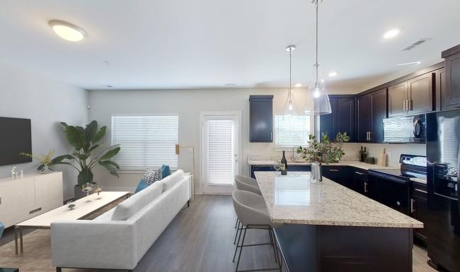 a kitchen with a dining table and couches
