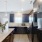 a kitchen with a bar and a couch