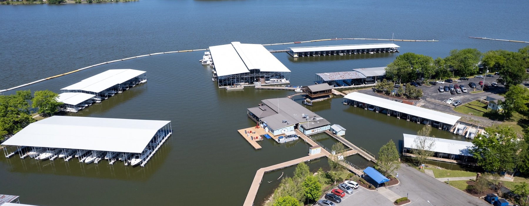 a body of water with buildings and trees around it